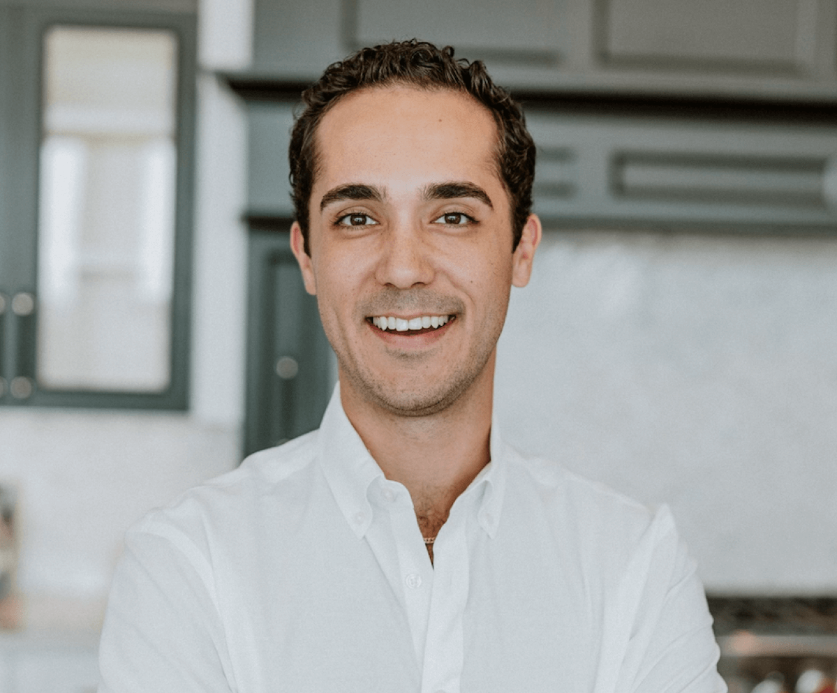 Meet Austin Bloom, Real Estate Professoinal at Keller Williams Arizona Realty, and Culture Committee Chairperson on the Keller Williams Arizona Realty Agent Leadership Council (ALC) for 2022. Austin has short dark hair, brown eyes, is wearing a white shirt, facing forward, and is smiling.