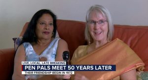 Donna Reed meets her pen pal after 50 years, they are talking and sitting on a couch.