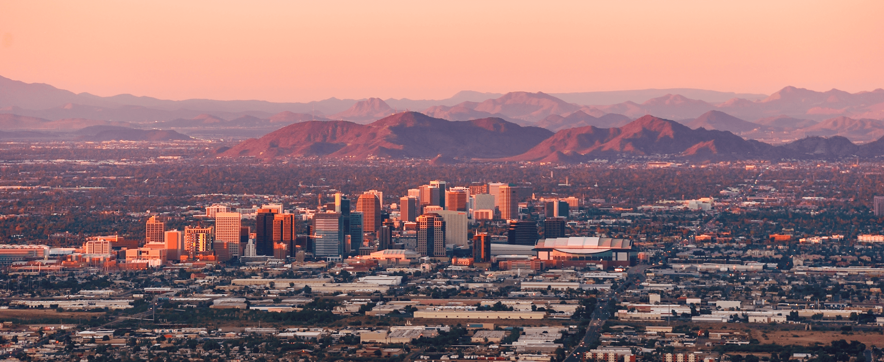 City of Phoenix skyline at dusk as the city itself prepares for the 2023 Phoenix Housing Market