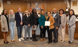 Community Partnerships Committee Members presenting certificate at Tempe City Council Meeting