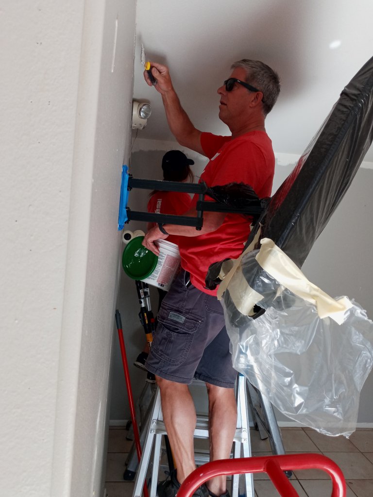 Jim Atkinson working on one of the walls in an apartment