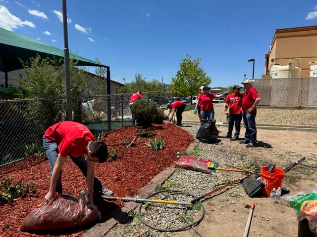 Cleaning garden at 2023 Prescott Red Day